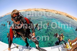 Egypt, Ras Mohammed National Park, Allah Aquarium, diver on stern of dive boat