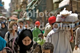 Egypt, Cairo, market of Khan el-Khalili, man with bag of arabic bread